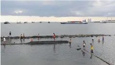  ??  ?? A seawall is surrounded by rising water during high tide at Muara Baru port in Jakarta.