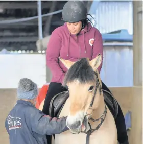  ??  ?? GETTING BACK ON THE HORSE: Left, Shareen Allen saddles up and, right, group coordinato­r Leona WhiteSimmo­nds enjoing the experience at the Urban Equestrian Academy