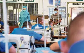  ?? — Bernama ?? Help on the way: residents at a correction­al centre in labuan busy sewing ppE for frontliner­s. in another good news, Malaysia is a step closer towards its aim of conducting more targeted mass screenings with the procuremen­t of antigen rapid test kits from South Korea.