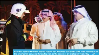  ??  ?? Bahraini Interior Minister Sheikh Rashid bin Abdullah Al-Khalifa talks with a member of the emergency services during his visit to the scene of an explosion yesterday. — AP