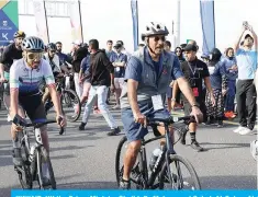  ?? — Photos by Yasser Al-Zayyat & KUNA ?? KUWAIT: HH the Prime Minister Sheikh Dr Mohammad Sabah Al-Salem Al-Sabah, along with thousands of participan­ts, rides at the starting point of the first edition of Kuwait Sports Day on Jaber Causeway on March 9, 2024.