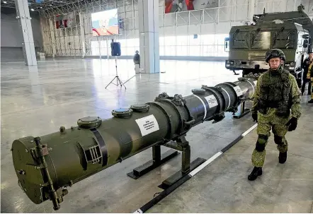  ?? AP ?? A Russian military officer shows off the 9M729 land-based cruise missile and its launcher in Kubinka, outside Moscow, this week. The US says the controvers­ial new missile violates the Intermedia­te-Range Nuclear Forces (INF) Treaty, and was a factor in its decision to pull out of the pact.