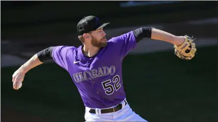  ?? ROSS D. FRANKLIN — THE ASSOCIATED PRESS ?? Colorado Rockies relief pitcher Daniel Bard throws a pitch during the first day of spring training workouts for Rockies pitchers and catchers Feb. 15 in Scottsdale, Ariz.