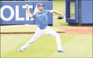  ?? Al Bello / Getty Images ?? Mets pitcher Jacob deGrom is listed as ‘day-to-day’ after experienci­ng back tightness on Tuesday night.