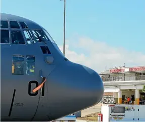  ?? NZ DEFENCE FORCE via AP ?? A New Zealand Defence Force Hercules aircraft arrives at Tonga’s Fua’amotu Internatio­nal Airport, near Nuku’alofa on Thursday last week to deliver aid.