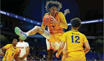  ?? COURTESY ?? Doryan Onwuchekwa, a four-star recruit from Faith Family Academy in Dallas, grabs a rebound this month during the Texas state playoffs. Onwuchekwa, a transfer from Colorado, agreed Tuesday to play for the Yellow Jackets.