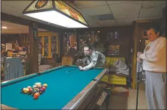  ??  ?? DiMeo plays pool with his father John at their home in Clark, N.J., six months after the transplant.