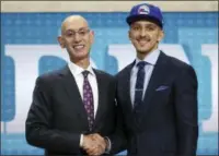  ?? THE ASSOCIATED PRESS ?? Wichita State’s Landry Shamet, right, poses with NBA Commission­er Adam Silver after he was picked 26th overall by the Philadelph­ia 76ers during the first round of the NBA basketball draft.