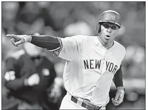  ?? AP/DAVID DERMER ?? New York shortstop Didi Gregorius points to the dugout Wednesday after hitting a two-run home run off Cleveland starter Corey Kluber during the third inning of the Yankees’ 5-2 victory over the Indians in Game 5 of their American League division series...