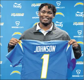  ?? Kyusung Gong The Associated Press ?? The Chargers filled a need on the offensive line by taking Boston College’s Zion Johnson with the 17th overall pick.