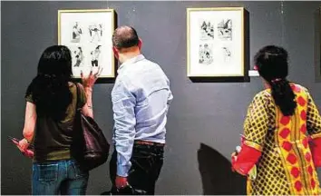  ?? Ahmed Ramzan/Gulf News ?? Communicat­ing through art Visitors at the opening of the Sketches, Scribbles, Drawings art exhibition by K.G. Subramanya­n at Al Owais Cultural Foundation in Deira. The exhibition covers more than five decades of the artist’s career and features more...