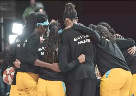  ?? CHICAGO SKY ?? Sky players wear warmup shirts bearing the name of police shooting victim Breonna Taylor and the words “Say her name” before their season opener Sunday.