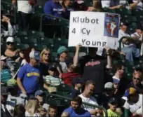  ?? TED S. WARREN — THE ASSOCIATED PRESS ?? A fan holds a sign promoting Corey Kluber for the AL Cy Young.