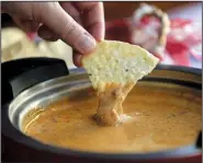  ?? Democrat-Gazette file photo ?? Third-fattest city Little Rock loves its cheese dip. So does 35th-fattest city Fayettevil­le.