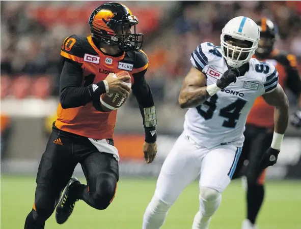  ?? GERRY KAHRMANN/PNG ?? B.C. Lions quarterbac­k Jonathon Jennings had a rough night running away from Llevi Noel and the Toronto Argonauts during Saturday’s regular-season finale at B.C. Place. The Lions ended their dismal season with a 40-13 loss to the playoff-bound Argos.