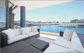  ??  ?? SHIP SHAPE: The view from a three-bedroom apartment in Palgrave at the V&A Marina, for sale at R22 million.