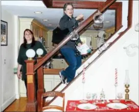  ??  ?? People walk through a home during the 51st Annual Mill Hill Holiday House Tour on Saturday.