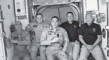  ?? NASA TNS ?? The Expedition 63 crew expanded to five members Sunday with the arrival of the SpaceX Crew Dragon. From left, Anatoly Ivanishin, Ivan Vagner, Chris Cassidy, Bob Behnken and Doug Hurley.