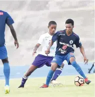  ??  ?? The brilliant Jamaica College forward Tyreek Magee (right) takes possession of the ball as Casseam Priestly of Kingston College moves in to tackle during yesterday’s ISSA/FLOW Walker Cup final at the National Stadium.