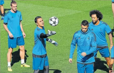  ?? REUTERS ?? (From left) Real Madrid's Gareth Bale, Keylor Navas, Cristiano Ronaldo and Marcelo during a training session in Madrid.