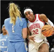  ?? AP ?? Ohio State forward Cotie McMahon drives against North Carolina guard Alyssa Ustby in the first half Monday. McMahon, a Centervill­e grad, scored 14 points.