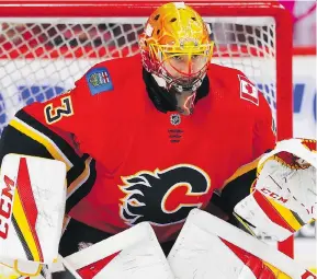  ?? AL CHAREST ?? Flames rookie goalie David Rittich already has a story he can tell his grandchild­ren: about how Czech hockey hero Jaromir Jagr fired a shot at his head in his first practice.