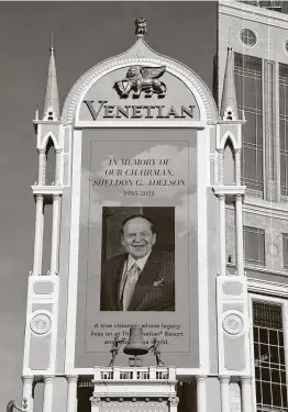  ?? Ethan Miller / Getty Images ?? The marquee at The Venetian Las Vegas displays a tribute to Las Vegas Sands Corp. Chairman and CEO Sheldon Adelson.