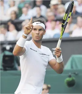  ?? Picture: EPA ?? OUT?. Rafael Nadal of Spain gestures to the umpire as he plays Russian 30th seed Karen Khachanov in their third round match during the Wimbledon Championsh­ips yesterday.