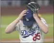  ?? THE ASSOCIATED PRESS ?? Los Angeles Dodgers starting pitcher Dustin May reacts after giving up a two-run home run to Tampa Bay Rays’ Brandon Lowe during the fifth inning in Game 2of the baseball World Series Wednesday, Oct. 21, 2020, in Arlington, Texas.