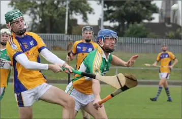  ??  ?? Peter Murphy (Taghmon-Camross) clears his line despite the best efforts of Joe Coleman (Duffry Rovers).