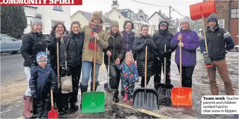  ??  ?? Team work Teachers, parents and children worked hard to clear snow in Kippen.