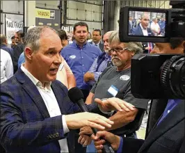  ?? ADAM BEAM / AP ?? EPA Administra­tor Scott Pruitt appeared at a company that sells coal mining supplies in Hazard, Kentucky, to announce an end to the Obama-era clean power plan.