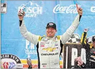  ?? JAE C. HONG / AP ?? Kyle Busch celebrates after winning a NASCAR Cup Series race at Auto Club Speedway in Fontana on Sunday.