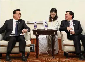  ??  ?? Cordial talks: Liow (left) discussing matters with Feng during their meeting in Beijing.