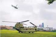  ?? JACQUELYN MARTIN/ASSOCIATED PRESS ?? The Marine One helicopter, top, carrying President Donald Trump to the Demilitari­zed Zone takes off from Seoul, South Korea, this morning.