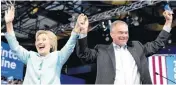 ??  ?? Hillary Clinton campaigns with her running mate, Sen. Tim Kaine, during a rally Saturday in Miami, Fla.