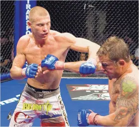  ?? JOURNAL FILE ?? Donald Cerrone, left, is shown during a WEC fight in 2009. Cerrone, now the all-time leader with 21 wins in UFC history, looks to add to his record Saturday.