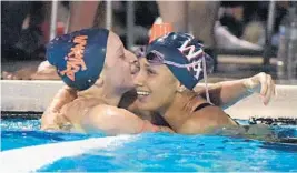  ?? JIM RASSOL/STAFF FILE PHOTO ?? Jessica Nava of Westminste­r Academy, right, hugs Alessandra Baldari of Benjamin following the Girls 100-yd. butterfly final last year. The two and a host of other swimmers and divers are beginning their quests for a state title.