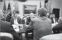  ?? DOUG MILLS / THE NEW YORK TIMES ?? Alvin Not Afraid, far right, the Crow Nation chairman, meets with President Donald Trump June 28 in the Roosevelt Room of the White House. The Trump administra­tion is encouragin­g more coal mining on lands owned by the federal government.