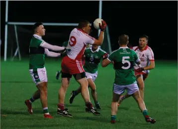  ??  ?? Tinahely’s David Dillon catches this ball during the JBFC clash with Bray Emmets.