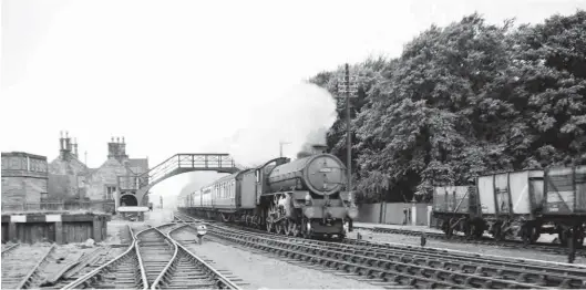  ?? J W Armstrong Collection/ARPT ?? About 11 miles from the hubbub of Carlisle’s Citadel station is the tranquil charm of Brampton Junction, its peace proving fragile as Thompson ‘B1’ No 61276 hurries past with a Newcastle express in the mid-1950s. Completed by North British Locomotive Vo in January 1948, this 4-6-0 served from Darlington until June 1959, when moved to York for exactly six years, to be withdrawn and scrapped at Ellis Metals, Derwenthau­gh. As for this location, the coming of the Newcastle & Carlisle route – this section was opened from Greenhead to Carlisle London Road in July 1836 – brought about a diversion for Lord Carlisle’s Brampton Railway, a mineral line with roots going back to 1798. Ultimately, it was the earlier route from Lambley to Brampton Town that crossed the N&C route and created Brampton Junction, albeit Milton rather than Brampton was initially core to the name. The Brampton line to Lambley turned south behind the camera, while the one-mile branch to Brampton Town started northwards from the other end of the station, so near the rear of the pictured train. The line was worked for many years by a ‘BTP’ from London Road shed.