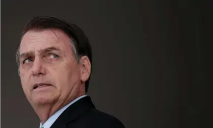  ??  ?? Jair Bolsonaro lived in the same beachside Rio apartment block as one of Marielle Franco’s alleged killers. Photograph: Ueslei Marcelino/ Reuters