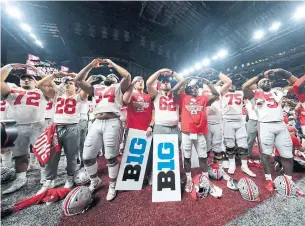  ?? AJ MAST THE ASSOCIATED PRESS FILE PHOTO ?? Ohio State players celebrate their 34-21 win over Wisconsin in the Big Ten championsh­ip game in 2019. The Buckeyes will get a chance to defend their title this year, depite playing only five games.