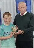  ??  ?? Shane Merriman accepts the under-12 Clubman award.