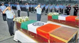  ?? RAVI KUMAR/HT PHOTO ?? Airforce officials pay tributes to Sergeant K Milind Kishor and Corporal Nilesh Kumar Nayan, killed in a gunfight with militants in J&K, at Chandigarh on Thursday.