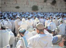  ?? ARIEL SCHALIT, AP ?? Jewish men pray at the Western Wall in Jerusalem’s Old City. Prayers traditiona­lly have been segregated by gender.