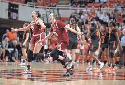  ?? OU guards Skylar Vann (24) and Taylor Robertson (30) celebrate after beating OSU 80-71 on March 4 at Gallagher-Iba Arena in Stillwater. Both teams made the NCAA women’s basketball tournament on Sunday. BRYAN TERRY/THE OKLAHOMAN ??