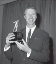  ?? ASSOCIATED PRESS FILE ?? In a May 18, 1967, file photo, Leeds United’s England internatio­nal Jack Charlton holds his award after being elected Footballer of the Year by the Football Writers’ Associatio­n at the Associatio­n’s annual dinner at the Cafe Royal, London.