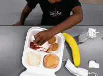  ?? Katie Currid / New York Times ?? A student uses his fingers to eat at Rising Hill Elementary in Kansas City, Mo., where the school district has had to make supply runs to big box stores for food and plastic cutlery.