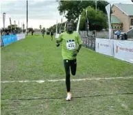  ?? Picture: TANIA ZWIEGELAAR PHOTOGRAPH­Y ?? HOME AND DRY: Nedbank’s Thabang Mosiako won the NMB Kariega Human Race on Saturday